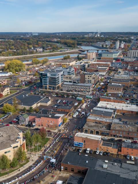 Aerial view of a Main Street district with a regional workforce corridor along the river